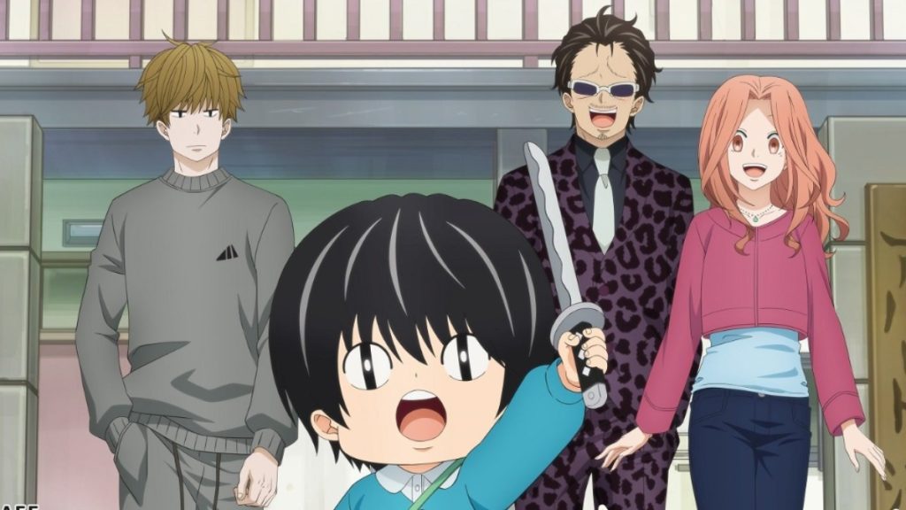A boy with holding a toy sword with three adults standing behind him. 
