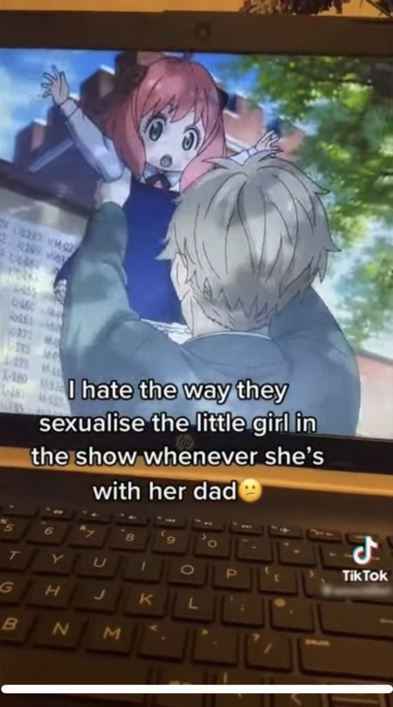 A TikTok post showing a screenshot of Spy x Family character Loid holding his adoptive daughter Anya. The caption reads, "I hate the way they sexualise the little girl in the show whenever she's with her dad :/""