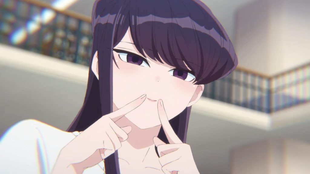 Komi making the smile gesture to Tadano.